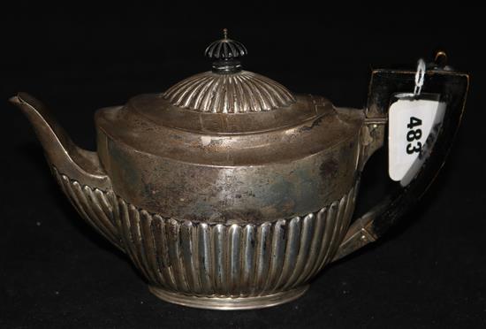 A Victorian silver oval demi-fluted teapot, by Walter & John Barnard, London, 1885,